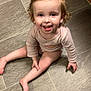 baby, barefoot, child, curly_hair, cute, face, floor, happy, indoor, onesie, person, pink_nail_polish, playful, sitting, skin, small_child, smiling, tile_floor, toddler, young