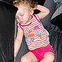 Layla is registered to the contest to win money with this photo: barefoot, bed, blanket, casual_pose, child, curly_hair, cute, earrings, indoors, peaceful, person, pillow, pink_shorts, relaxed, resting, sleeping, soft_lighting, striped_clothing, toddler, young_child