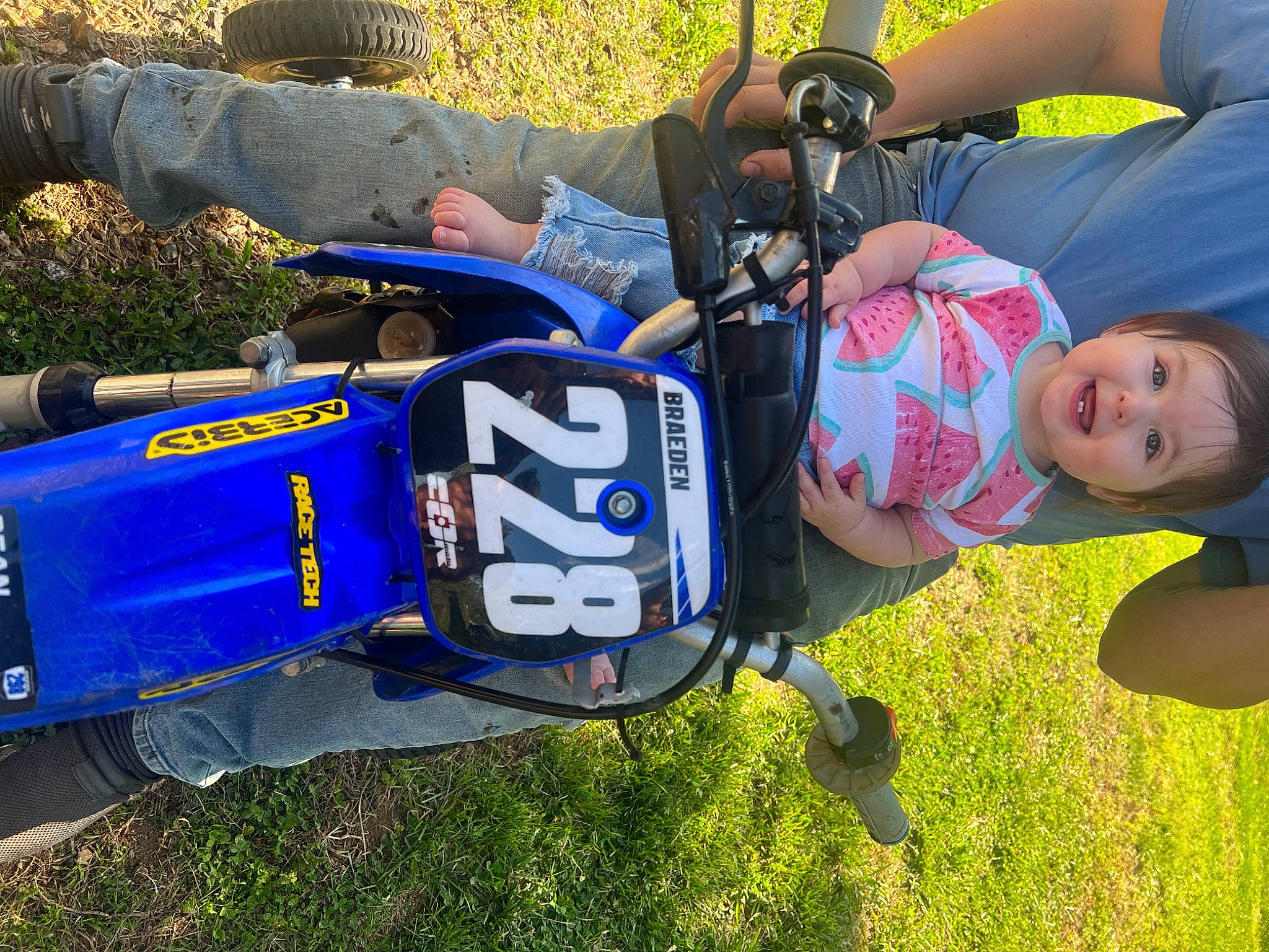 Oaklyn joined the competition — help win amazing prizes! baby, baby_products, baby_toddler_clothing, child, electric_blue, fun, grass, grassland, lawn, leisure, person, personal_protective_equipment, plant, recreation, sitting, toddler