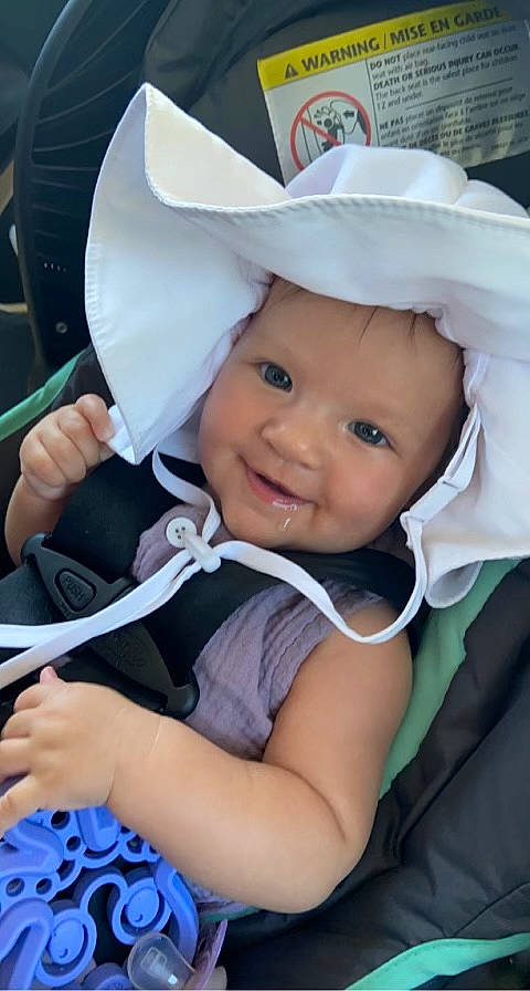 Sophia joined the competition — help win amazing prizes! baby, baby_products, baby_toddler_clothing, blue, cap, cheek, child, comfort, costume_hat, eye, fun, happy, hat, headwear, iris, person, skin, sleeve, smile, sun_hat