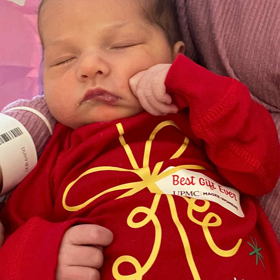 Alorah joined the competition — help win amazing prizes! baby, closeup, cozy, cute, face, festive, hand, holiday, indoors, infant, newborn, peaceful, person, portrait, red_clothing, resting, sleeping, soft, wrapped, young_child