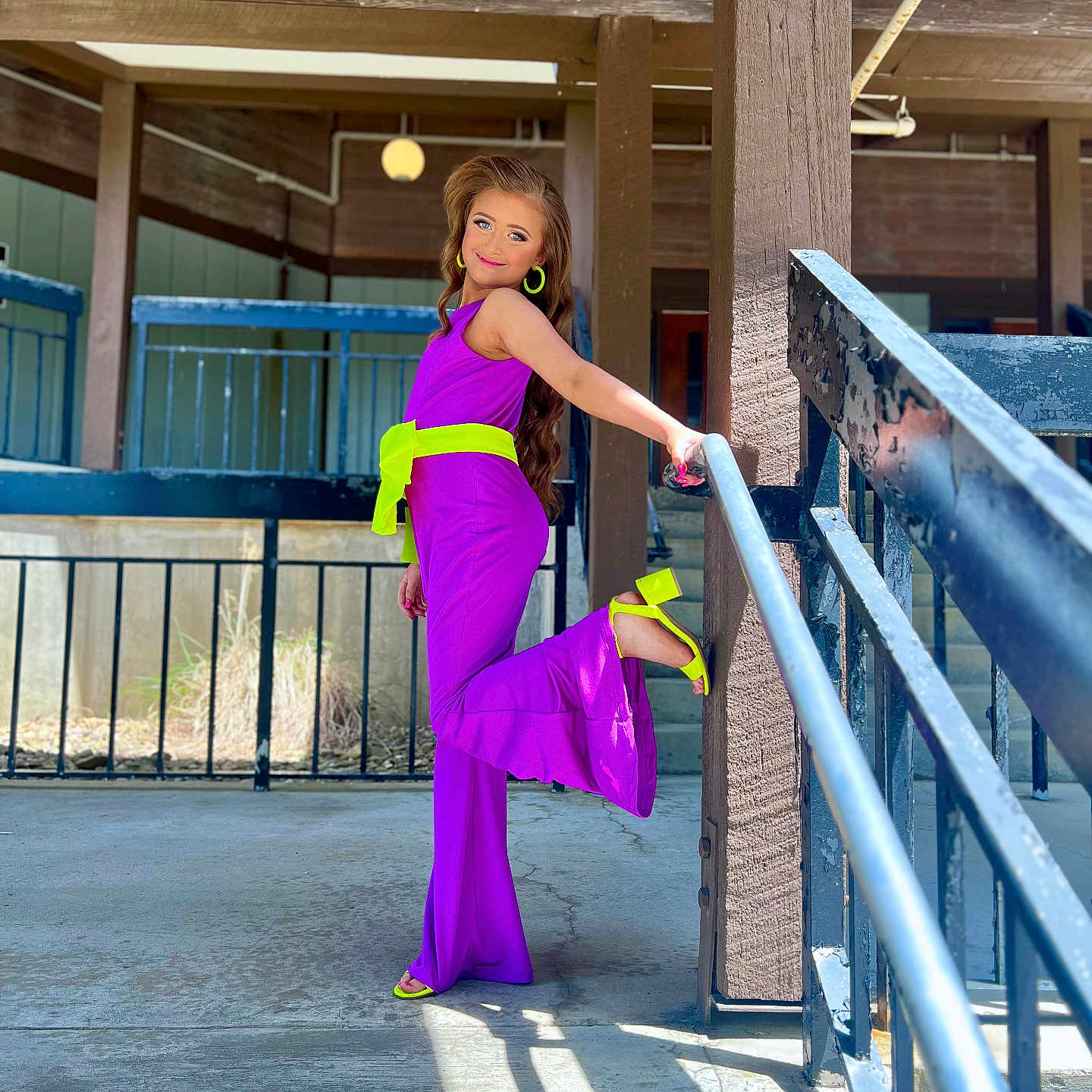 Madelyn joined the competition — help win amazing prizes! accessories, adult, architecture, bag, clothing, dress, eveningdress, face, female, formalwear, handbag, handrail, head, pants, person, photography, portrait, purple, railing, woman