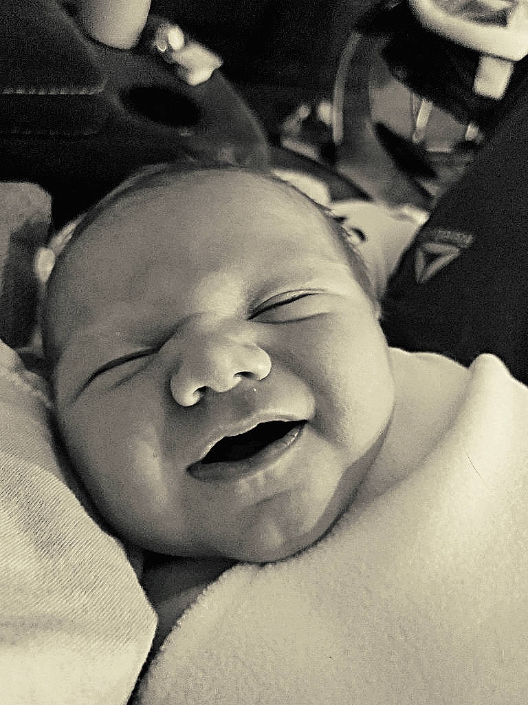Maveryk is registered to the contest to win money with this photo: baby, bedtime, birth, black_and_white, cheek, child, face, facial_expression, happy, head, laugh, lip, monochrome, mouth, nose, person, photography, skin, sleep, smile