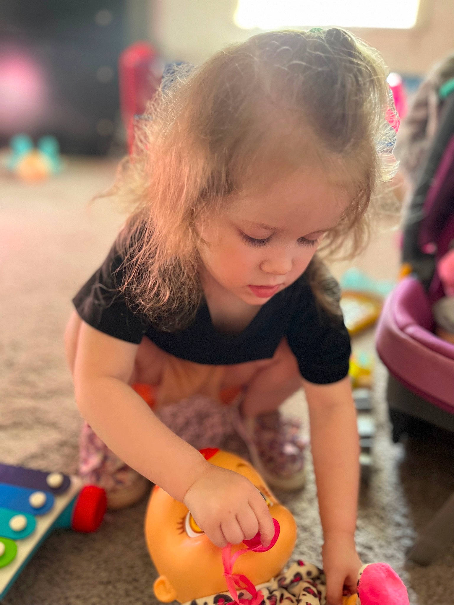 Katelyn is registered to the contest to win money with this photo: baby, baby_playing_with_toys, ball, child, event, facial_expression, flooring, fun, happy, leisure, party, people, person, photograph, recreation, sitting, snapshot, summer, toddler, toy