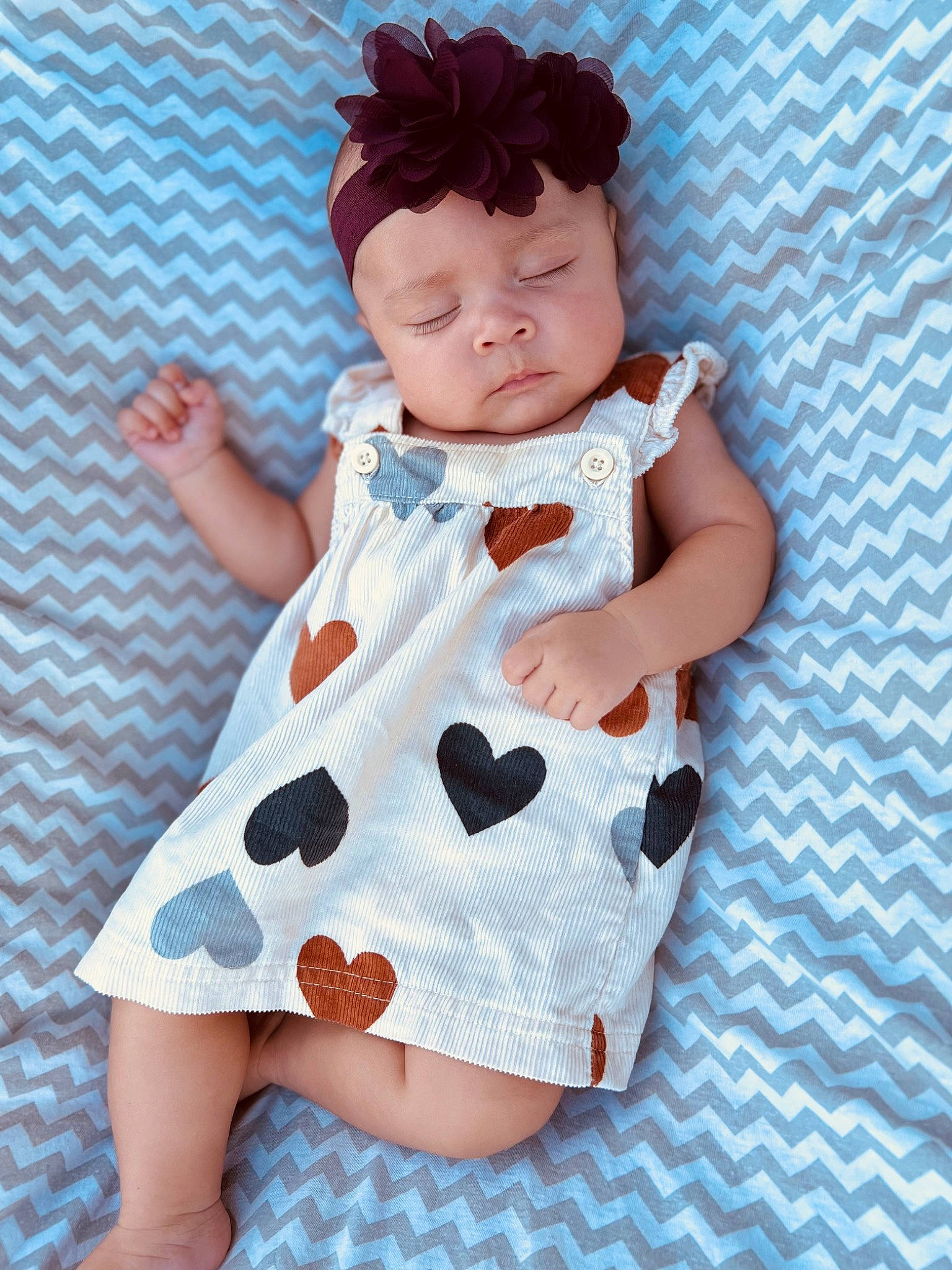 Makenley is registered to the contest to win money with this photo: baby, baby_toddler_clothing, brown_hair, child, day_dress, doll, dress, fashion_design, finger, headwear, nail, one_piece_garment, outerwear, pattern, peach, person, pink, skin, sleeve, textile