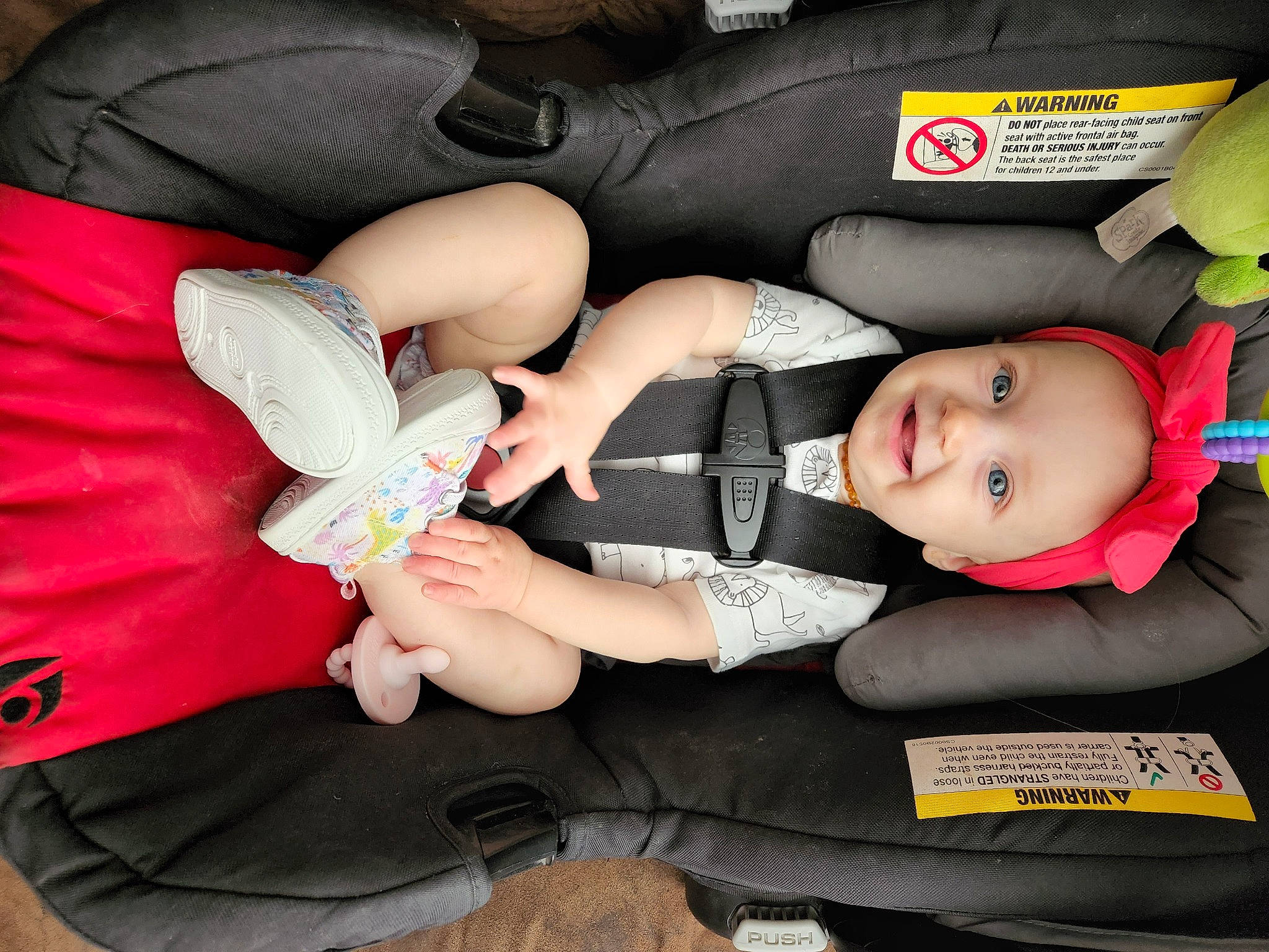 Violet is registered to the contest to win money with this photo: arm, baby, baby_carriage, baby_products, baby_toddler_clothing, car_seat, comfort, finger, fun, gesture, hand, human_leg, joint, lap, leg, nail, person, shoe, smile, thigh