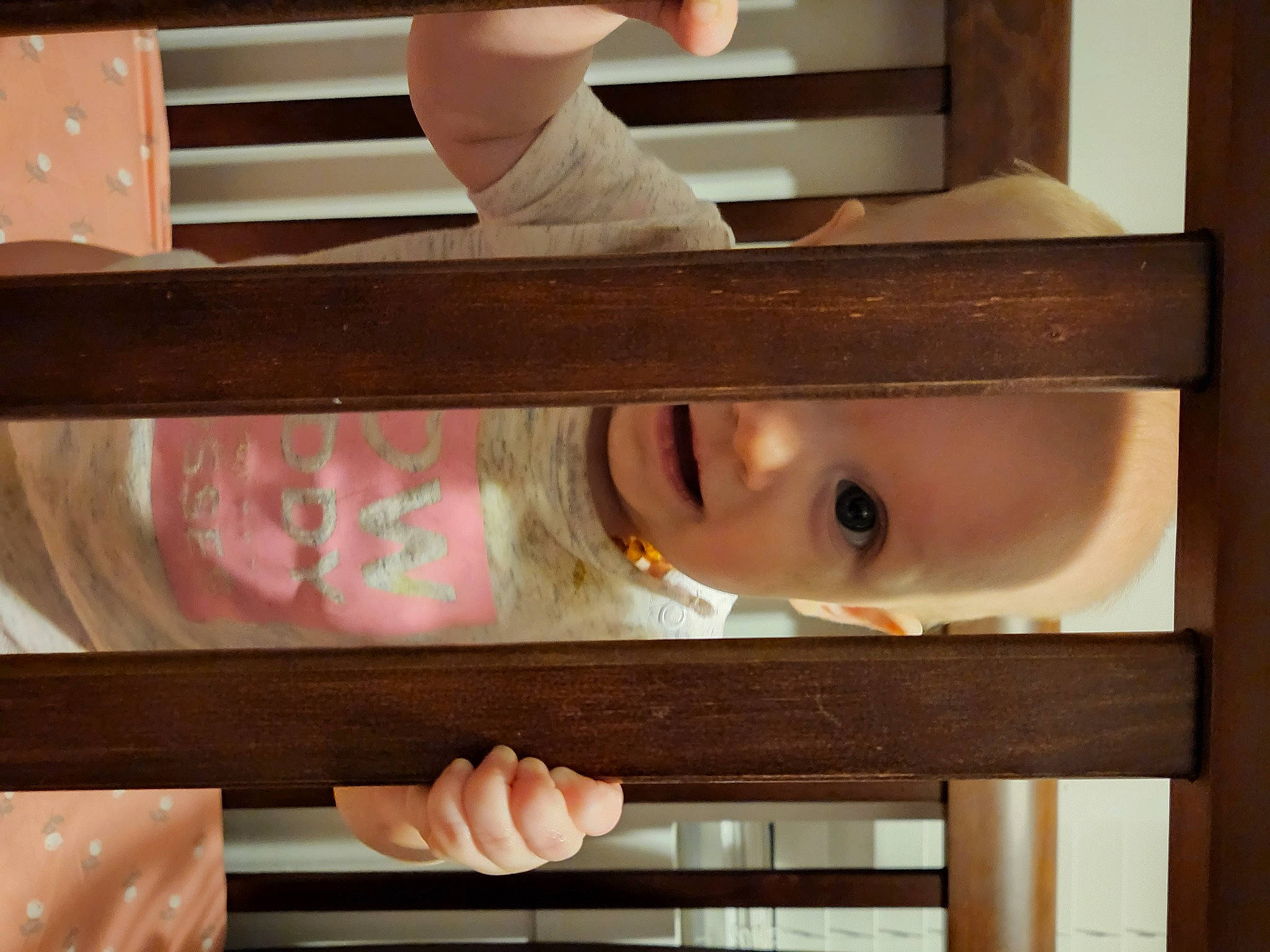 Violet is registered to the contest to win money with this photo: baby, baby_products, baby_safety, baby_toddler_clothing, bangs, cheek, child, eyelash, hand, hardwood, infant_bed, organ, peach, person, room, skin, stairs, toddler, window, wood