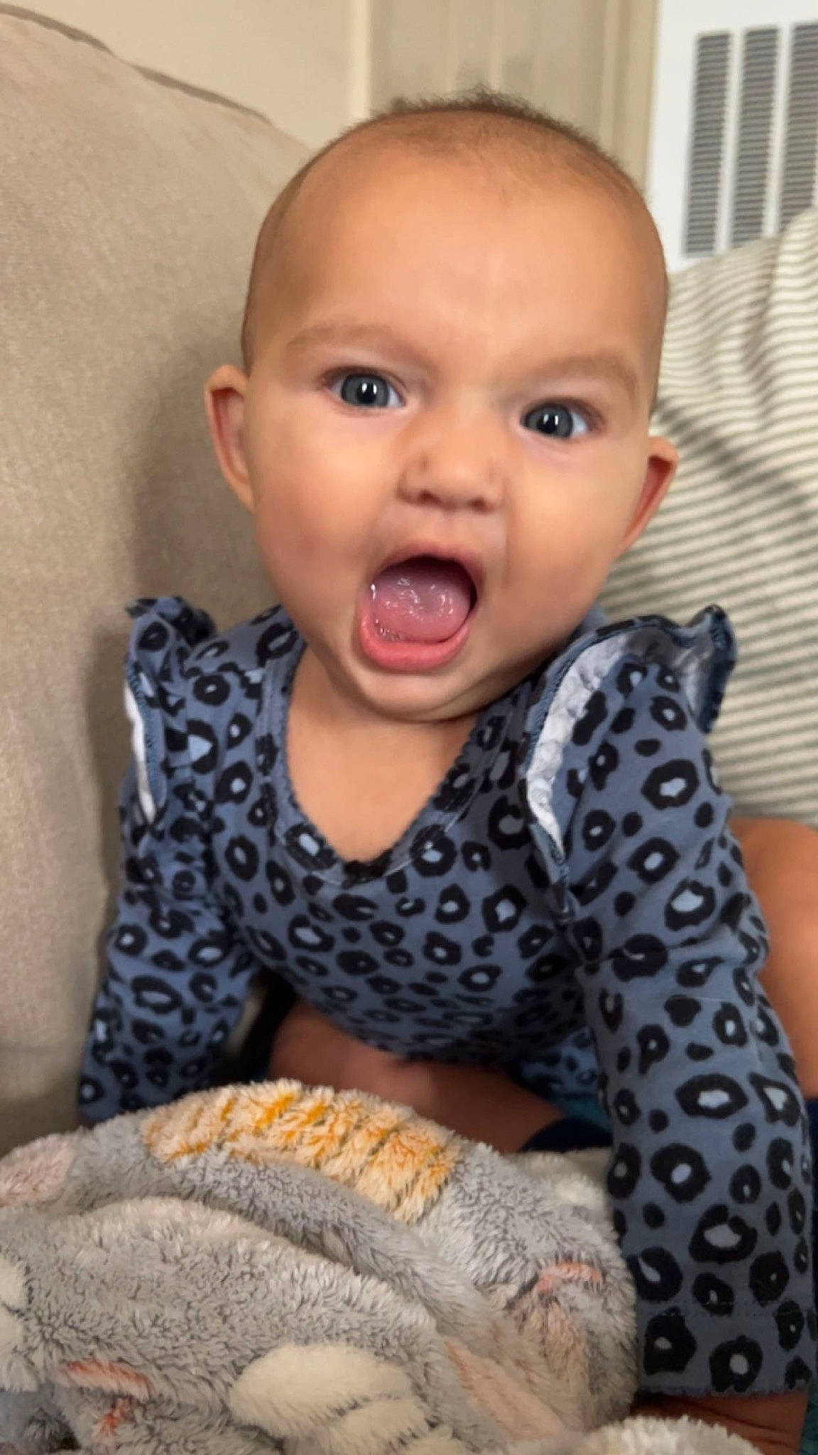 Kori is registered to the contest to win money with this photo: baby, baby_toddler_clothing, cheek, child, comfort, dress, eyelash, finger, gesture, happy, human_body, iris, lip, neck, nose, pattern, person, sitting, skin, sleeve