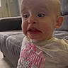 Alyona joined the competition — help win amazing prizes! toddler, child, indoor, couch, shirt, cartoon, cat, pink, expression, surprised, face, person, furniture, living_room, home, casual, cute, young, sitting, clothing