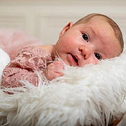 Nina Rose participe au concours pour gagner de l'argent avec cette photo : baby, infant, face, pink_lace, blanket, fluffy, soft_texture, portrait, cute, child, newborn, resting, cozy, closeup, indoors, person, head, skin, eyes, expression