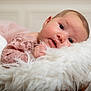 baby, infant, face, pink_lace, blanket, fluffy, soft_texture, portrait, cute, child, newborn, resting, cozy, closeup, indoors, person, head, skin, eyes, expression