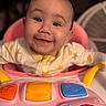 baby, smiling, infant, toy, colorful, pink, walker, face, happy, child, cute, clothing, play, indoors, closeup, person, joy, early_childhood, seat, expression