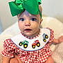 Hadleigh joined the competition — help win amazing prizes! baby, blue_eyes, child, closeup, curious_expression, cute, face, green_bow, headband, indoors, infant, person, portrait, red_checkered_clothing, sitting, skin, small_child, soft_blanket, tractor_applique, young