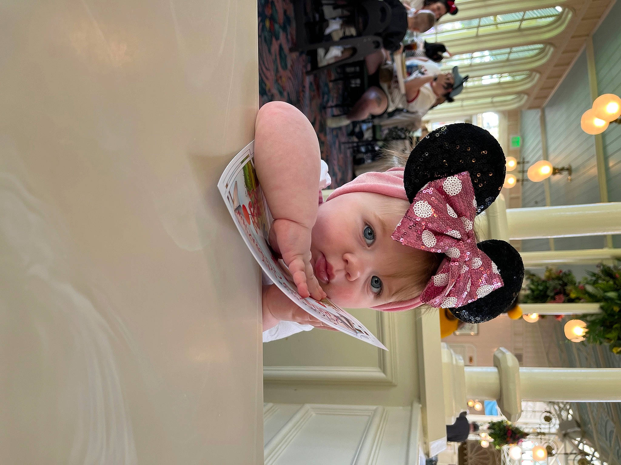 Antonia is registered to the contest to win money with this photo: baby, building, carmine, child, event, fun, happy, hat, headwear, magenta, person, pink, plant, room, toddler, tree, window