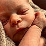 baby, newborn, sleeping, infant, close_up, face, cheek, nostrils, eyelids, hand, arm, blanket, soft_texture, cozy, peaceful, portrait, skin, wrinkles, adorable, nap