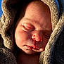 Gianna participe au concours pour gagner de l'argent avec cette photo : newborn, baby, infant, sleeping, blanket, towel, hood, face, closeup, portrait, skin, lips, nose, eyelashes, cheeks, cozy, peaceful, soft_texture, wrapped, family