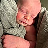 Gianna a rejoint le concours — aidez-le/la à gagner de superbes lots ! arm, baby, blanket, close_up, cozy, face, hand, indoors, infant, newborn, newborn_baby, peaceful, portrait, resting, rosy_cheeks, skin, sleeping, soft_texture, swaddle, towel