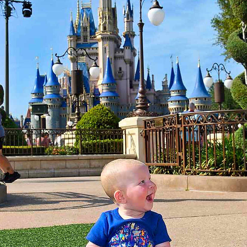 Aurelia joined the competition — help win amazing prizes! amusementpark, architecture, baby, building, castle, city, clothing, face, fortress, fun, grass, head, outdoors, person, photography, plant, portrait, shelter, t_shirt, themepark