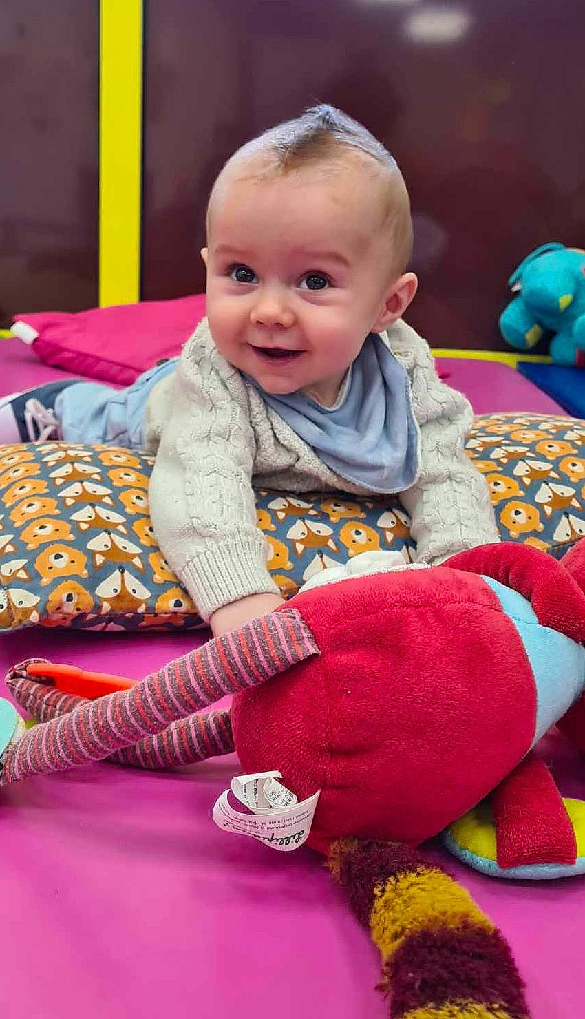 Livaï participe au concours pour gagner de l'argent avec cette photo : baby, baby_toddler_clothing, cheek, comfort, face, facial_expression, floor, flooring, fun, happy, head, organ, person, photograph, pink, product, purple, red, skin, smile