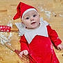 Melody is registered to the contest to win money with this photo: baby, baking, child, christmas_elf, cookie_cutter, cute, face, festive, flour, hat, holiday, indoor, kitchen, playful, portrait, red_clothing, rolling_pin, smiling, whisk, wooden_surface