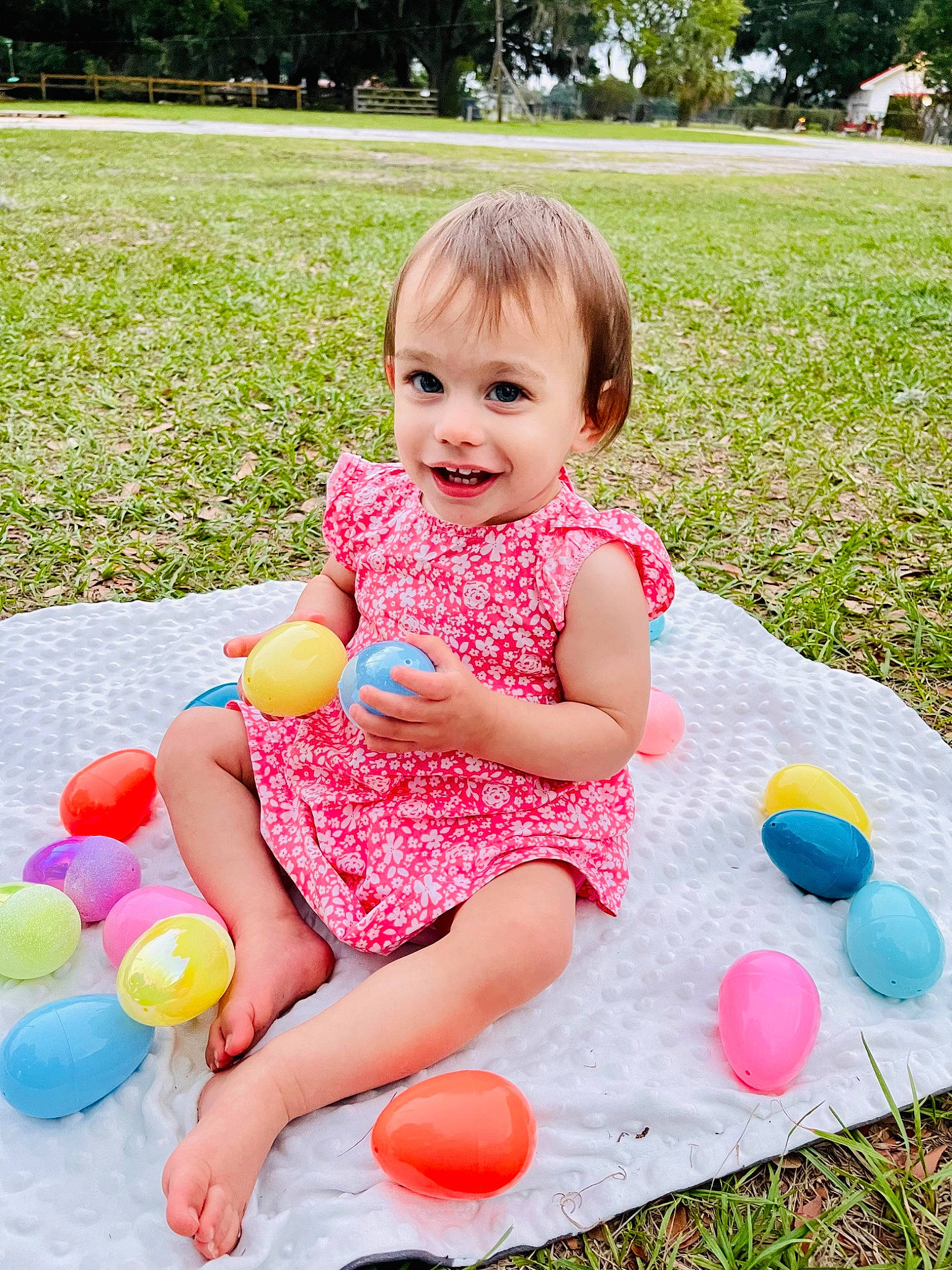 Rosalie joined the competition — help win amazing prizes! baby_toddler_clothing, balloon, clothing, dress, facial_expression, fun, grass, happy, joy, leisure, people, people_in_nature, person, photograph, pink, plant, recreation, smile, summer, toddler