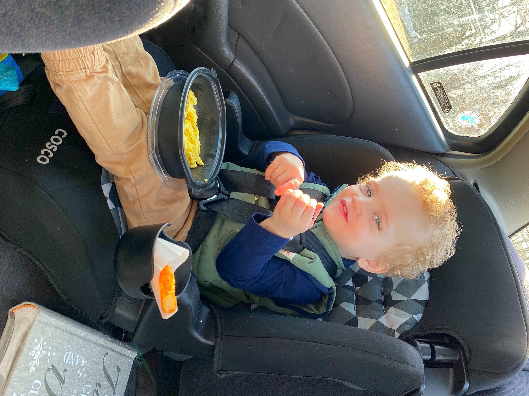 Carter is registered to the contest to win money with this photo: air_travel, airline, auto_part, automotive_design, automotive_exterior, car, car_seat, car_seat_cover, family_car, head_restraint, mode_of_transport, motor_vehicle, person, personal_luxury_car, seat_belt, service, steering_part, steering_wheel, vehicle, vehicle_door