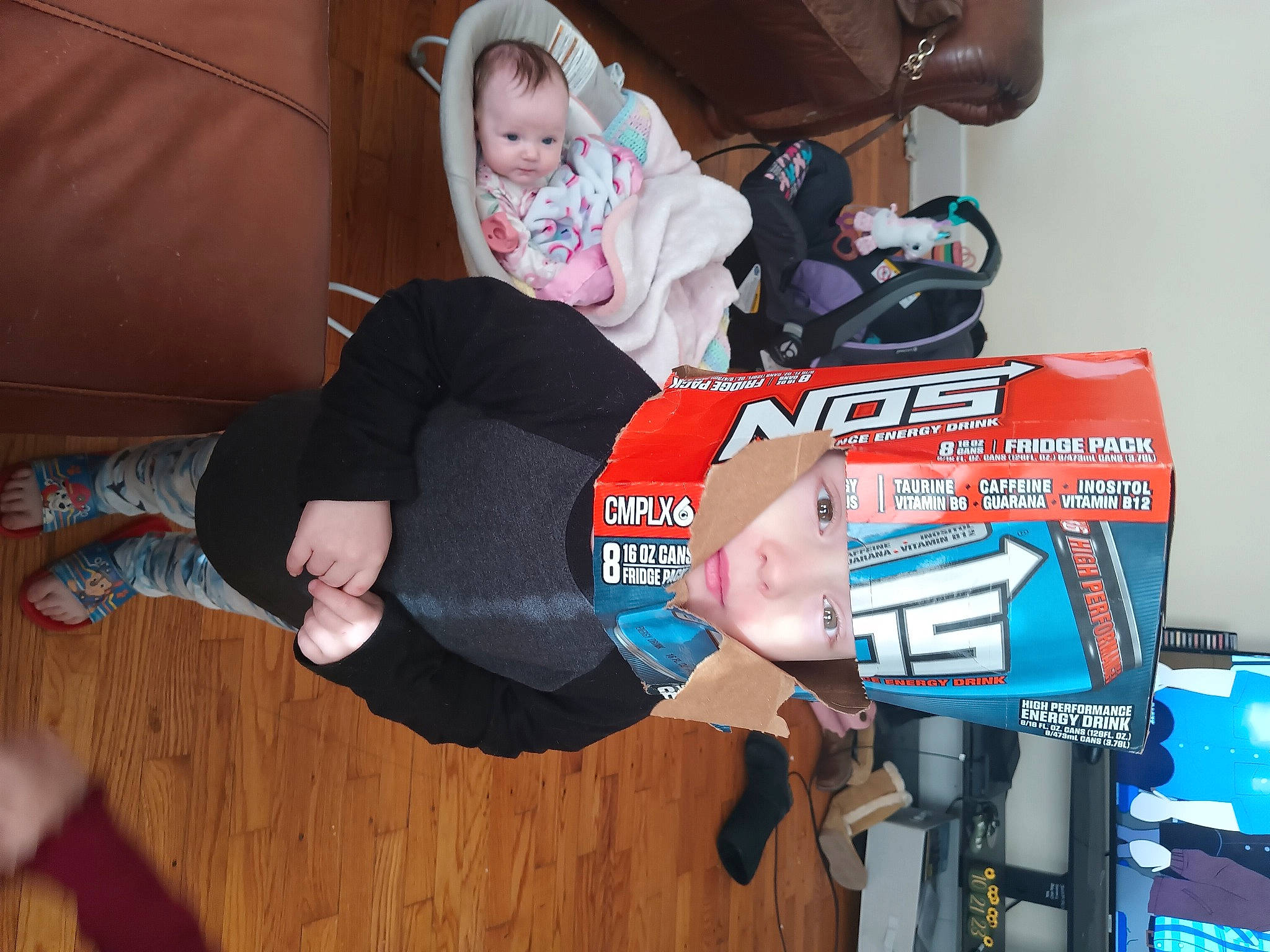 Charles joined the competition — help win amazing prizes! baby, child, comfort, fun, hardwood, hat, knee, lap, machine, person, room, sock, t_shirt, thigh, toddler, walking_shoe, wood, wrist