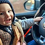 toddler, child, smiling, hat, knit_hat, car_interior, steering_wheel, clothing, hand, person, portrait, happy, cozy, seat, window, blurred_background, warm_clothing, indoor, face, baby
