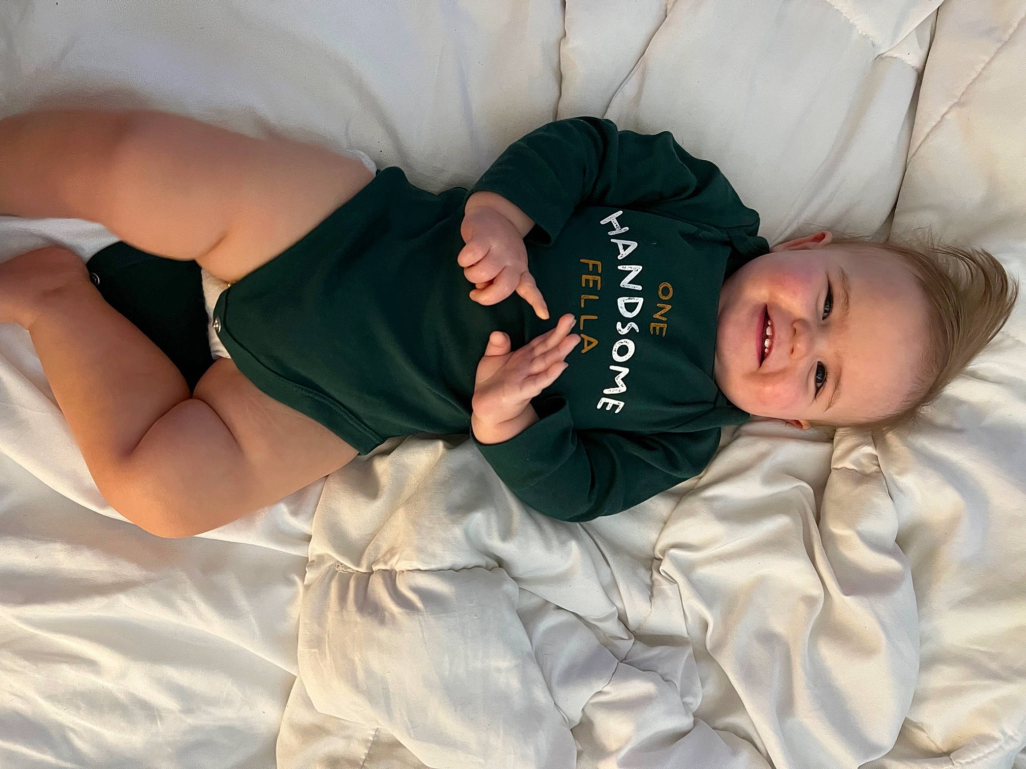 Landon joined the competition — help win amazing prizes! abdomen, black_hair, comfort, elbow, flash_photography, happy, hat, human_body, human_leg, joint, joy, knee, leg, person, sleeve, smile, textile, thigh, toddler, tree