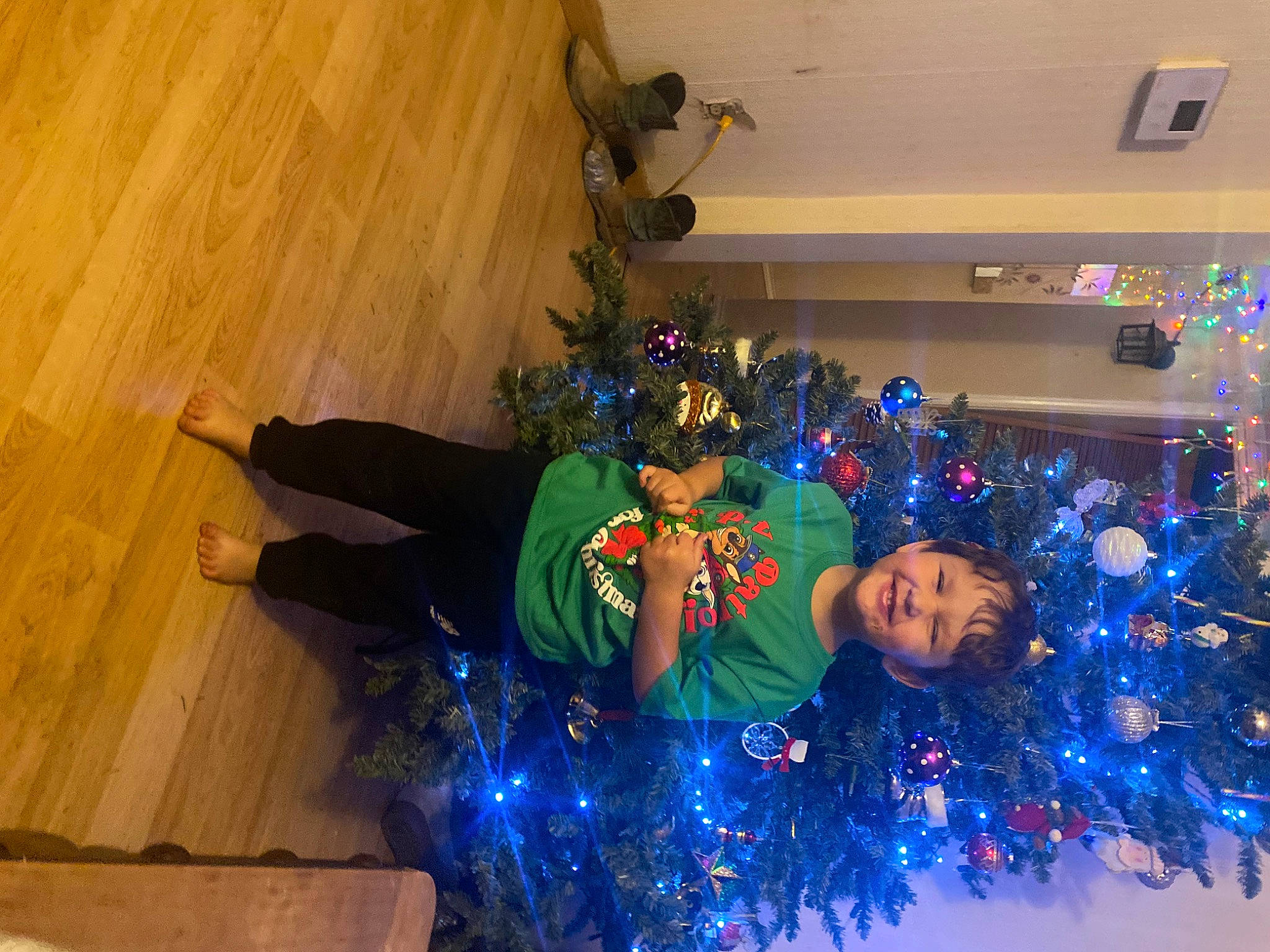 Cason joined the competition — help win amazing prizes! christmas, christmas_decoration, christmas_eve, christmas_ornament, christmas_tree, electric_blue, event, flooring, fun, happy, hardwood, hat, holiday, holiday_ornament, joy, ornament, person, plant, room, tree