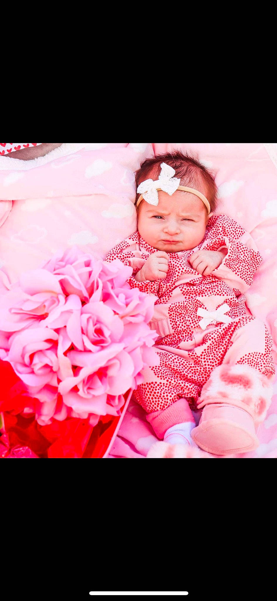 Sarai is registered to the contest to win money with this photo: baby, baby_toddler_clothing, child, cut_flowers, event, flash_photography, flower, hair_accessory, happy, headwear, hybrid_tea_rose, magenta, pattern, peach, person, petal, pink, rose, rose_family, rose_order