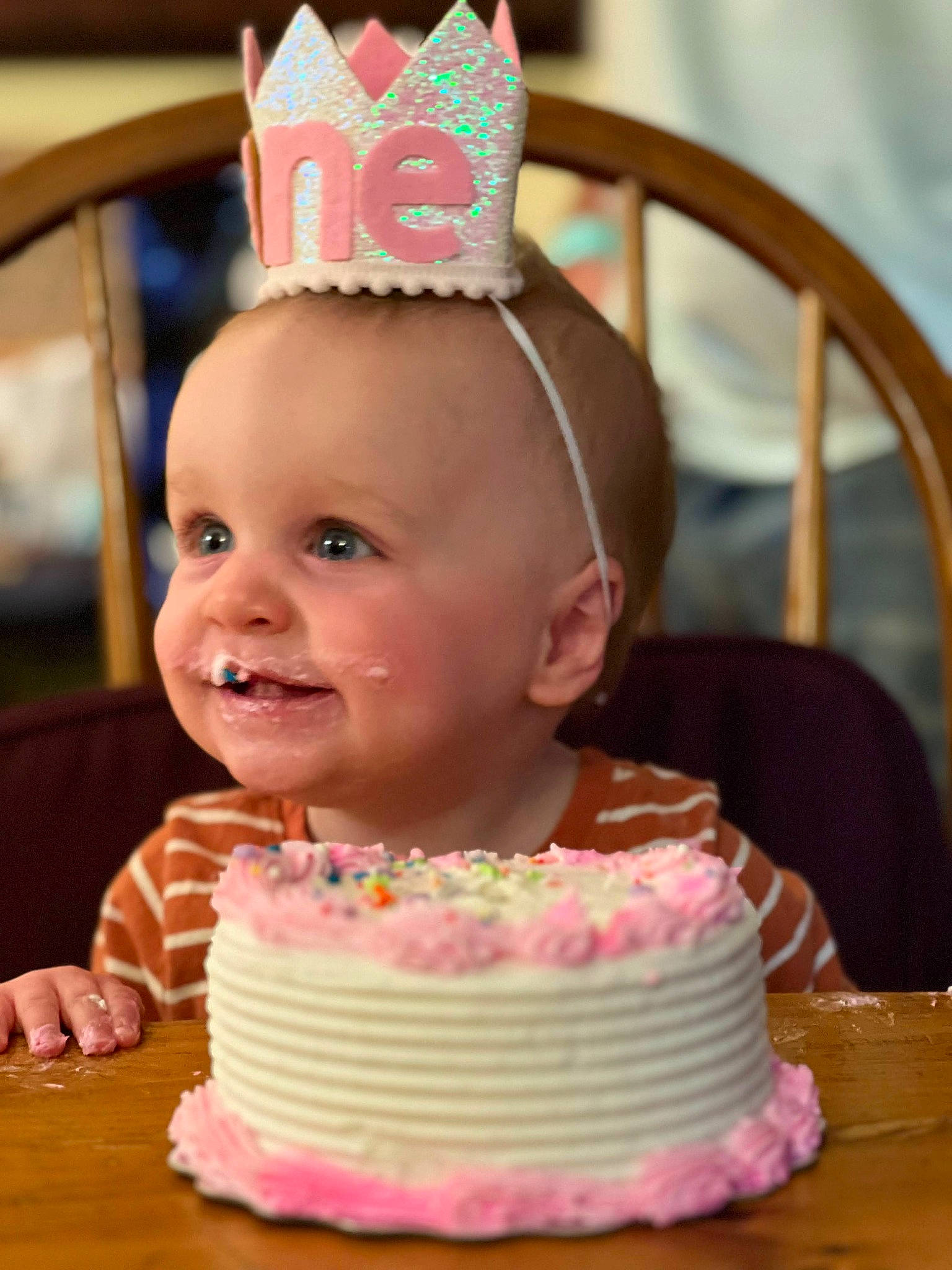 Briella is registered to the contest to win money with this photo: baby, baked_goods, birthday_cake, birthday_party, cake, cake_decorating, cake_decorating_supply, child, costume_hat, event, food, happy, joy, party_hat, party_supply, person, pink, smile, sugar_cake, table