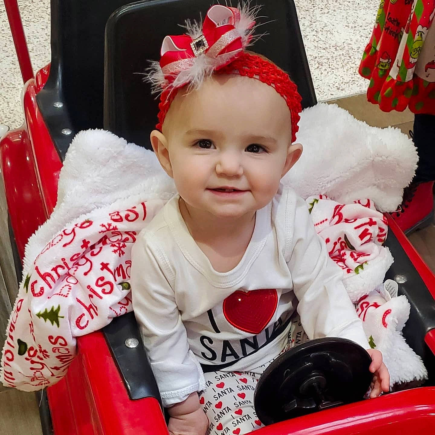 Kenna is registered to the contest to win money with this photo: baby, baby_toddler_clothing, cap, cheek, child, costume_hat, event, facial_expression, fashion_accessory, fun, happy, head, joy, pattern, person, pink, product, red, sleeve, smile