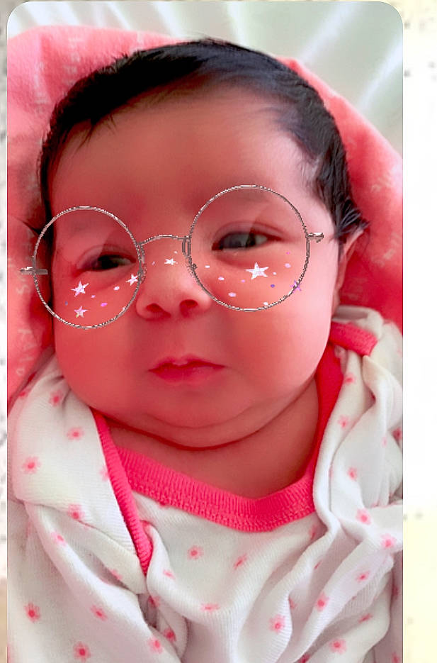 Michaella is registered to the contest to win money with this photo: baby, cheek, child, chin, close_up, eye, eyebrow, eyewear, face, facial_expression, forehead, glasses, head, lip, mouth, nose, person, pink, skin, smile