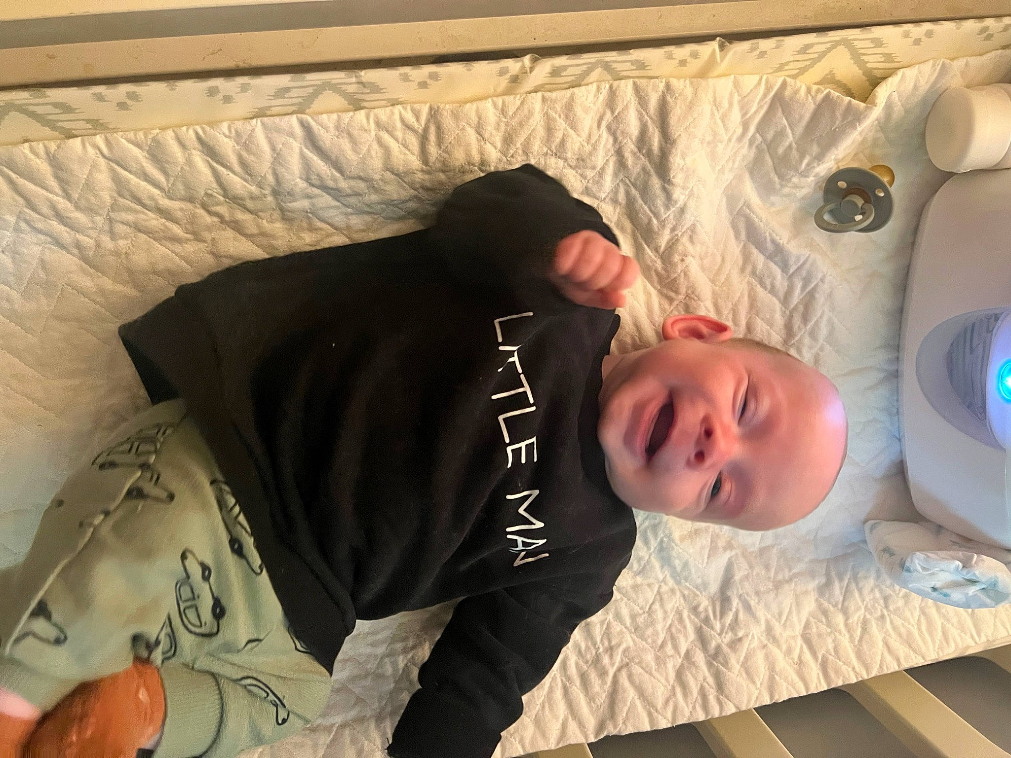 Beckham is registered to the contest to win money with this photo: baby, bathing, child, comfort, flooring, fun, happy, home_appliance, linens, mechanical_fan, nap, person, room, sitting, sleeve, smile, t_shirt, toddler, wood