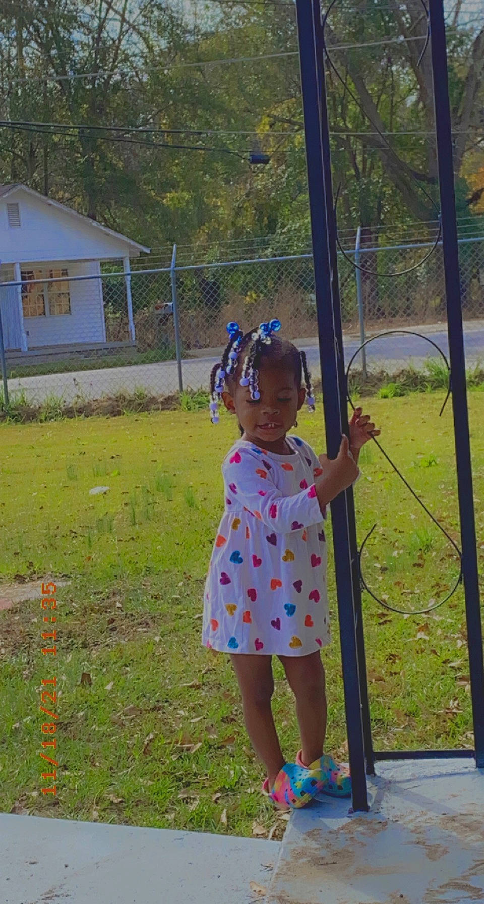 Journie is registered to the contest to win money with this photo: baby_toddler_clothing, child, city, dress, electric_blue, fun, grass, grassland, happy, leisure, magenta, pattern, people_in_nature, person, plant, recreation, sandal, toddler, tree, vacation