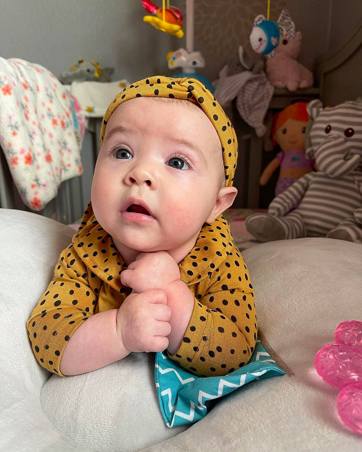 Paisley is registered to the contest to win money with this photo: baby, baby_products, baby_toddler_clothing, cap, cheek, child, comfort, eye, fun, happy, head, linens, mouth, person, pink, product, room, skin, sleeve, textile