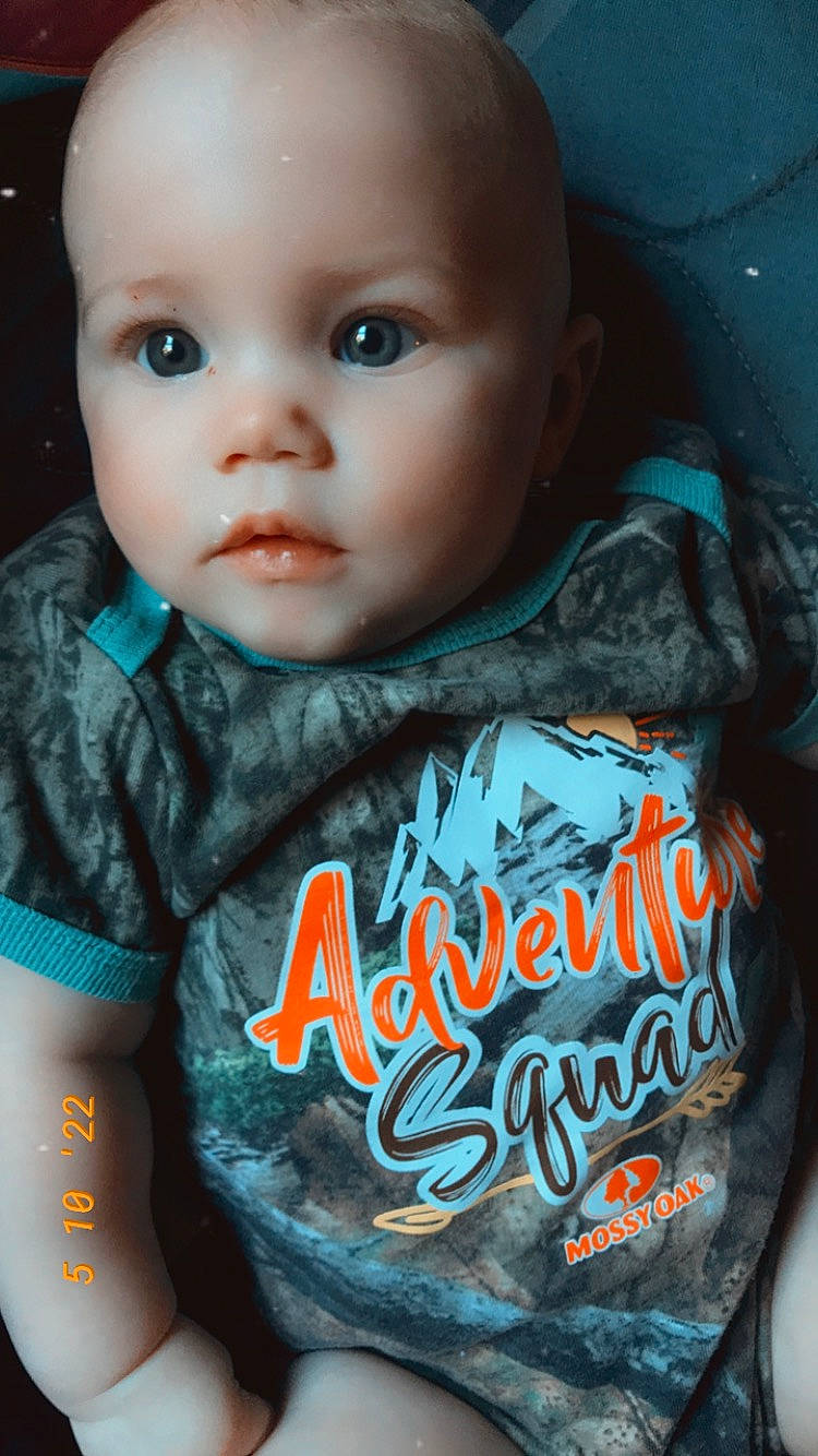 Katie is registered to the contest to win money with this photo: baby_toddler_clothing, black, cheek, chin, eye, eyebrow, flash_photography, forehead, hairstyle, iris, lip, mouth, neck, nose, organ, outerwear, person, skin, sleeve, t_shirt