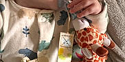 Elliott joined the competition — help win amazing prizes! baby, blanket, child, closeup, comfort, cute, fabric, giraffe, hand, indoors, infant, nap, pacifier, pajamas, peaceful, plush_toy, rest, sleeping, soft, toy