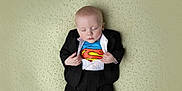 Elliott joined the competition — help win amazing prizes! baby, baby_boy, blanket, child, clothing, costume, cute, face, fashion, hands, indoor, infant, lying_down, peaceful, portrait, sleeping, soft_texture, superhero, superman, tuxedo