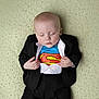 baby, superhero, superman, tuxedo, sleeping, child, infant, blanket, clothing, cute, portrait, hands, face, lying_down, costume, baby_boy, fashion, soft_texture, peaceful, indoor