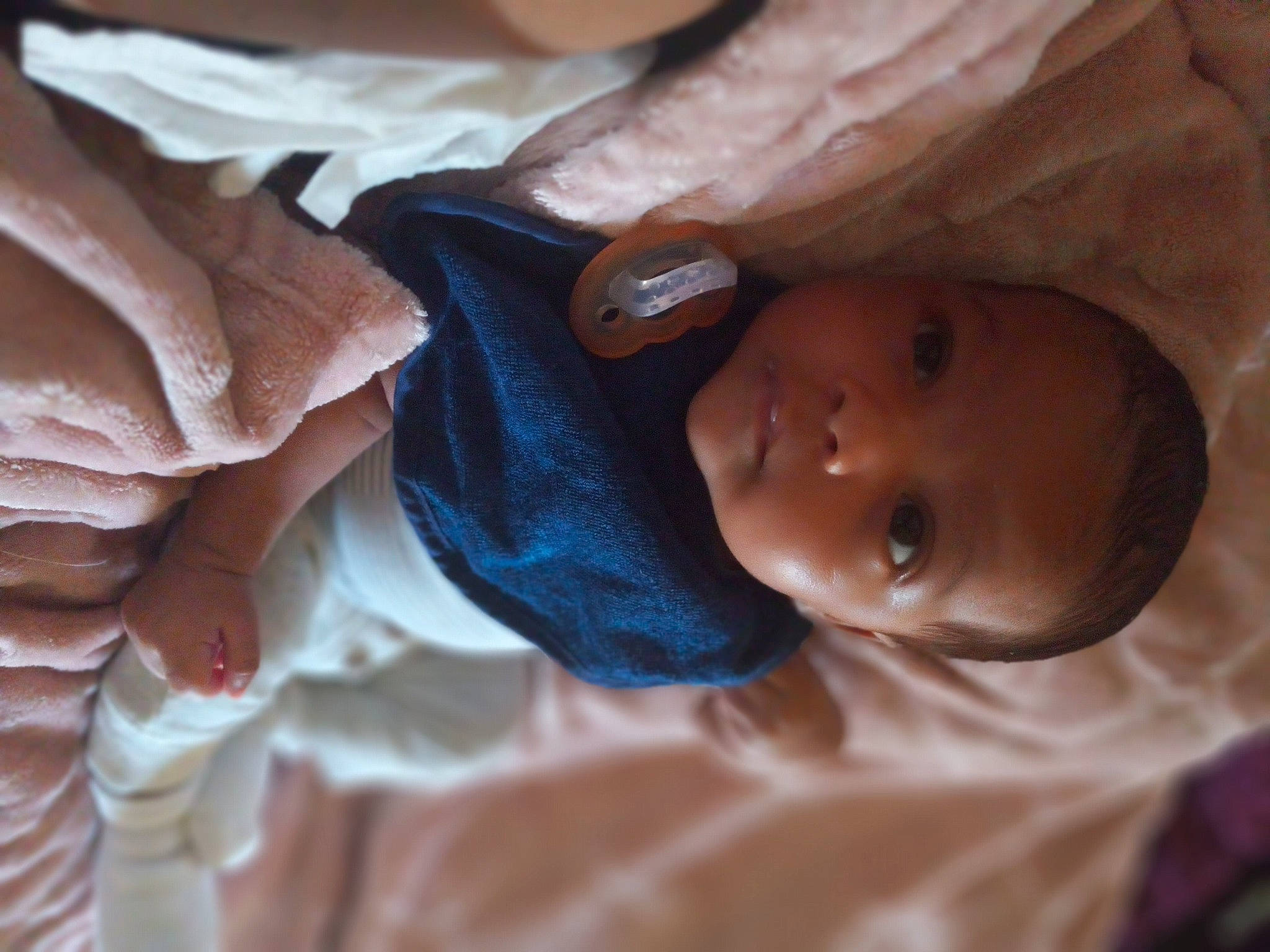 Nova is registered to the contest to win money with this photo: baby, cheek, child, chin, close_up, comfort, eye, eyebrow, gesture, hairstyle, headgear, human_body, iris, linens, lip, mouth, nose, person, skin, textile