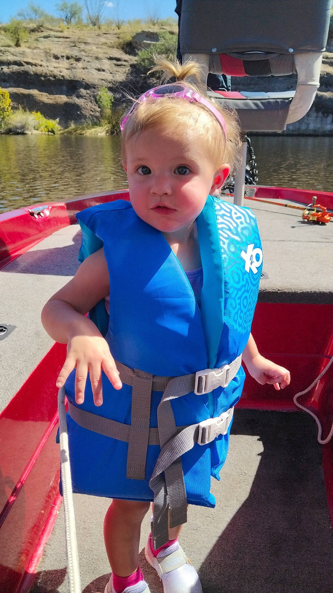 Lilly is registered to the contest to win money with this photo: baby, baby_products, baby_toddler_clothing, boats_and_boating_equipment_and_supplies, child, costume, electric_blue, fashion_accessory, fun, leisure, lifejacket, pattern, person, personal_protective_equipment, recreation, summer, sunglasses, toddler, travel, vacation