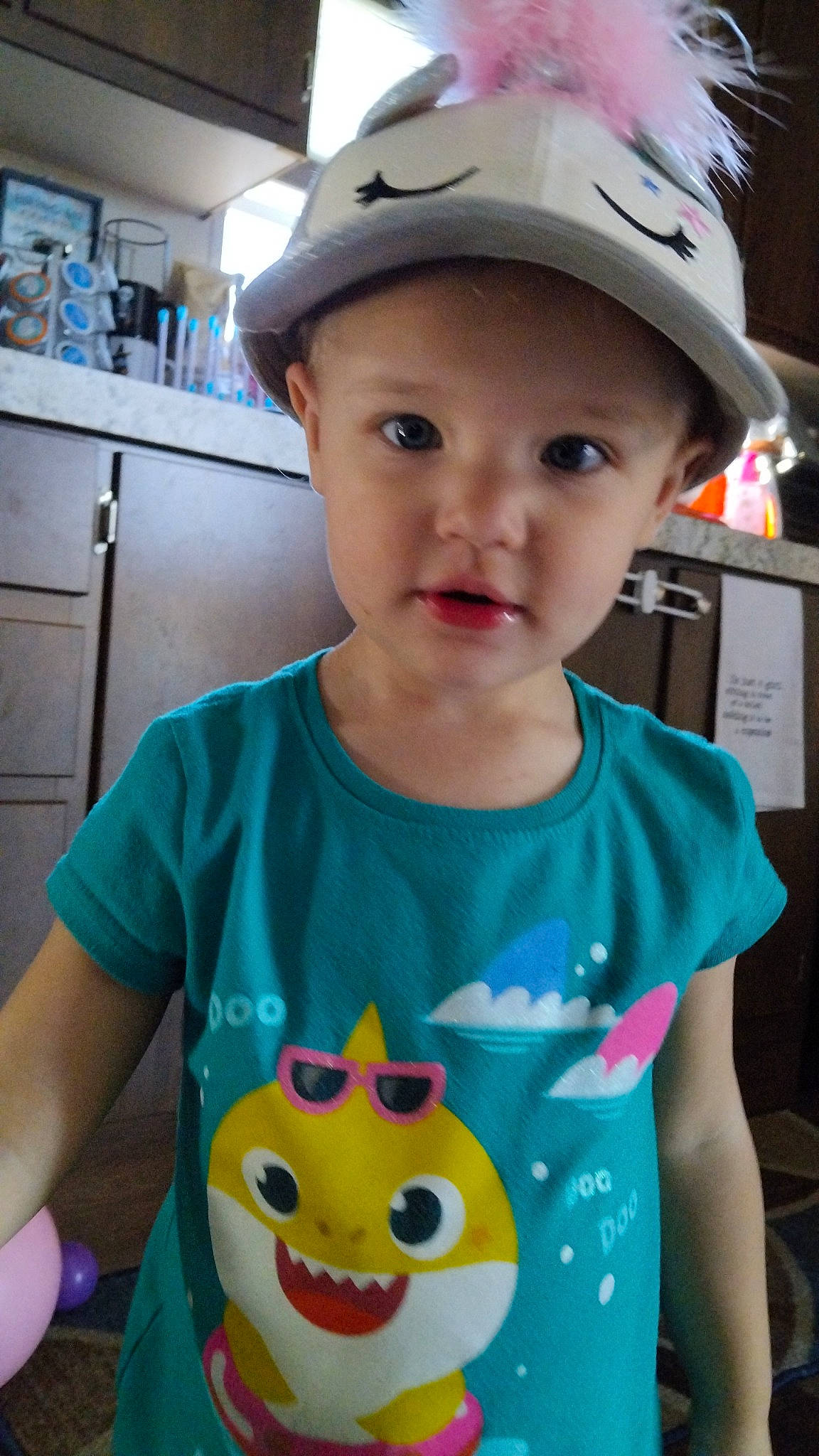 Lilly is registered to the contest to win money with this photo: baby_toddler_clothing, baseball_cap, blue, cabinetry, cap, child, cool, electric_blue, facial_expression, fashion_accessory, fun, hairstyle, happy, hat, headwear, person, sleeve, smile, snapshot, t_shirt