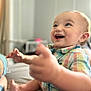 baby, babylaughing, bodypart, clothing, face, finger, hand, happy, head, indoors, laughing, mouth, pants, person, photography, portrait, sitting, smile, t_shirt, teeth