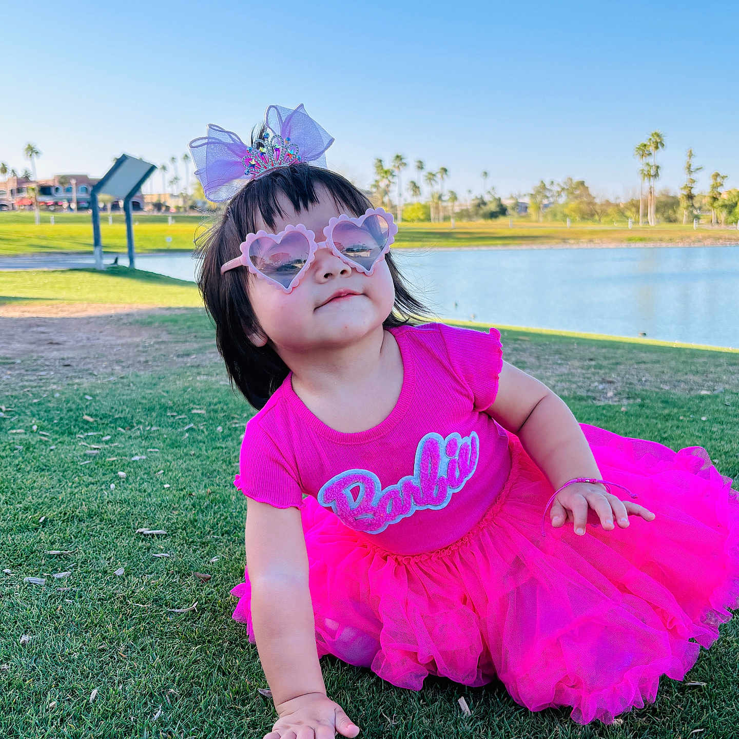 Dayana is registered to the contest to win money with this photo: accessories, child, clothing, dress, face, female, girl, glasses, grass, head, lawn, nature, outdoors, park, person, photography, plant, portrait, purple, summer