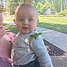 baby, child, lizard, green_lizard, outdoor, park, grass, trees, person, holding, shirt, pants, shoulder, daylight, nature, face, curious, animal, pet, sunlight