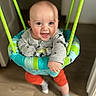 baby, child, smiling, indoor, swing, jumper, happy, face, clothing, socks, floor, ropes, toy, person, cute, infant, playtime, bright_colors, wood_floor, home