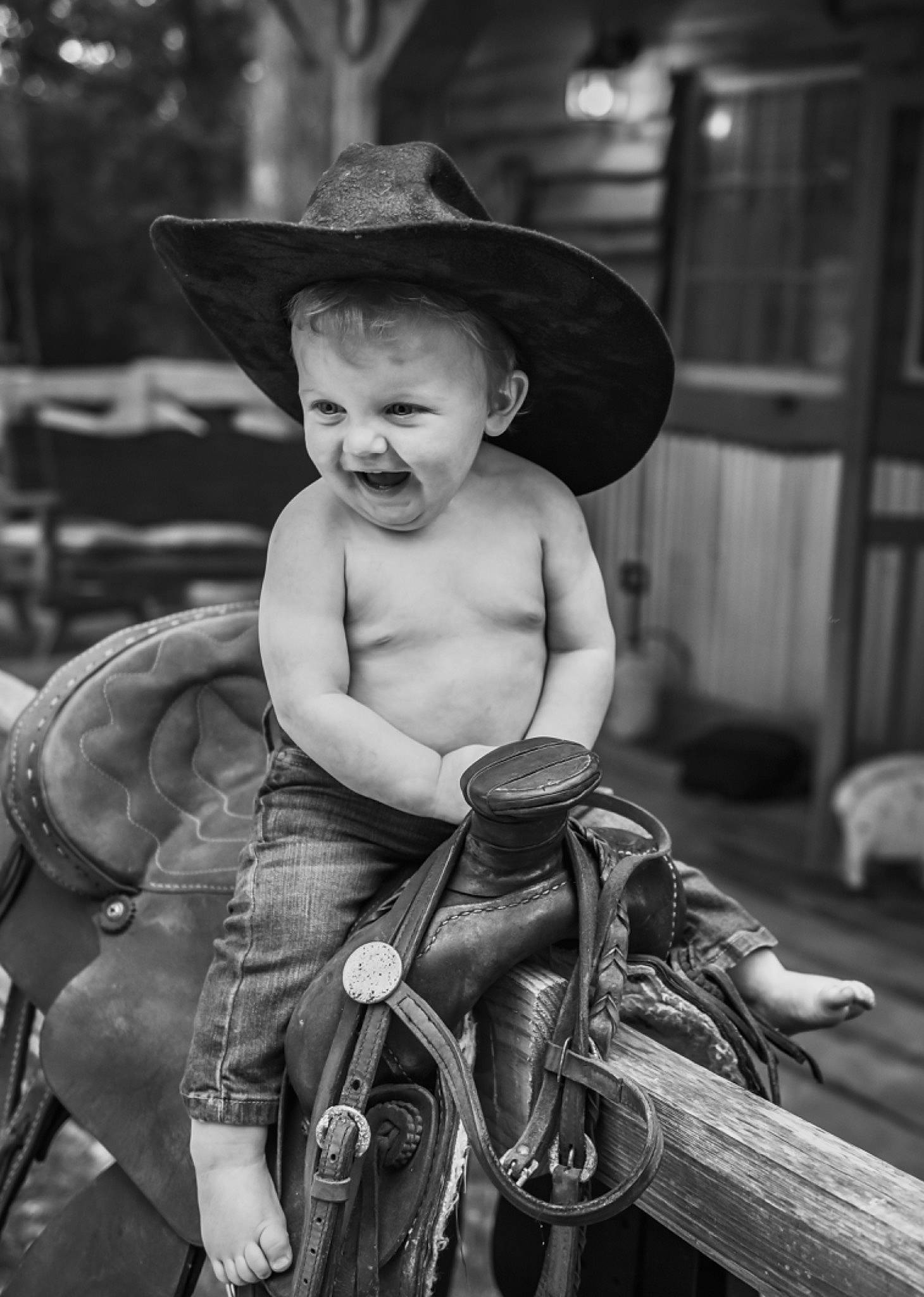 Dutton Riggs joined the competition — help win amazing prizes! black_and_white, child, cool, cowboy_hat, fashion_accessory, hat, headgear, horse, horse_tack, monochrome, monochrome_photography, person, rein, road, sitting, stock_photography, street, style, sun_hat, toddler