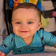 Abraham joined the competition — help win amazing prizes! baby, baby_clothing, background_blur, blue_shirt, cheerful, child, closeup, cute, dinosaur_print, expression, face, happy, indoor, infant, person, playtime, portrait, smile, toys, young_child